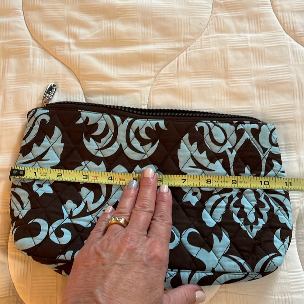Like new, chocolate, brown, and blue lined make up bag with gingham interior